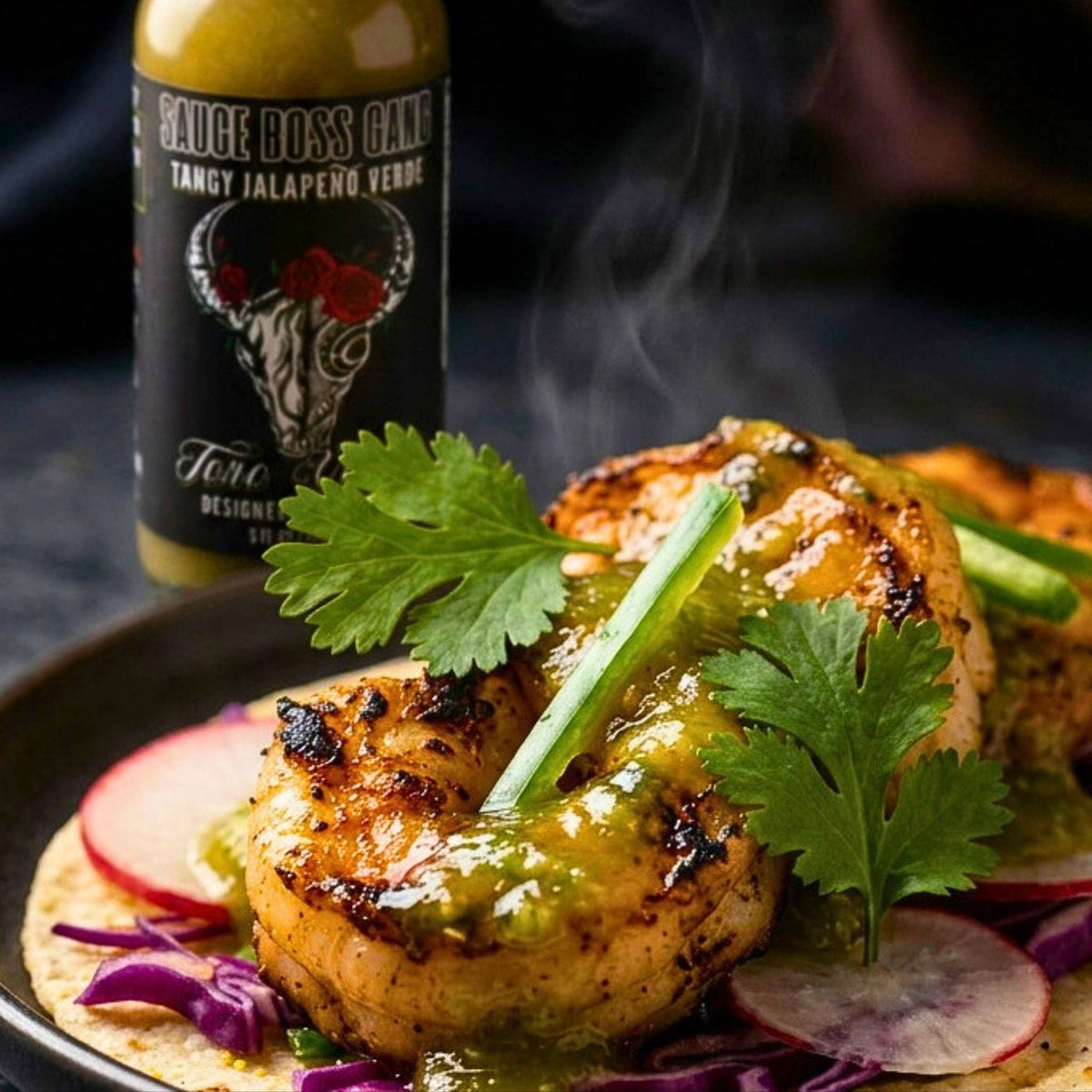 Toro Verde jalapeno hot sauce bottle beside grilled shrimp tacos topped with green sauce and cilantro